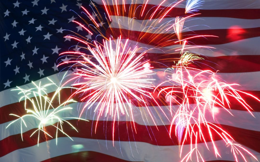fireworks exploding with image of american flag in background